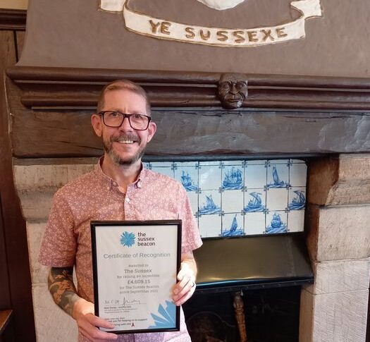 Certificate of Recognition presented to The Sussex pub in Hove for raising £4,600+ for local HIV charity, the Sussex Beacon
